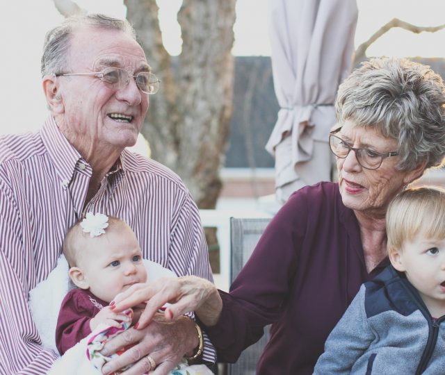 grandparents-holding-grandchildren